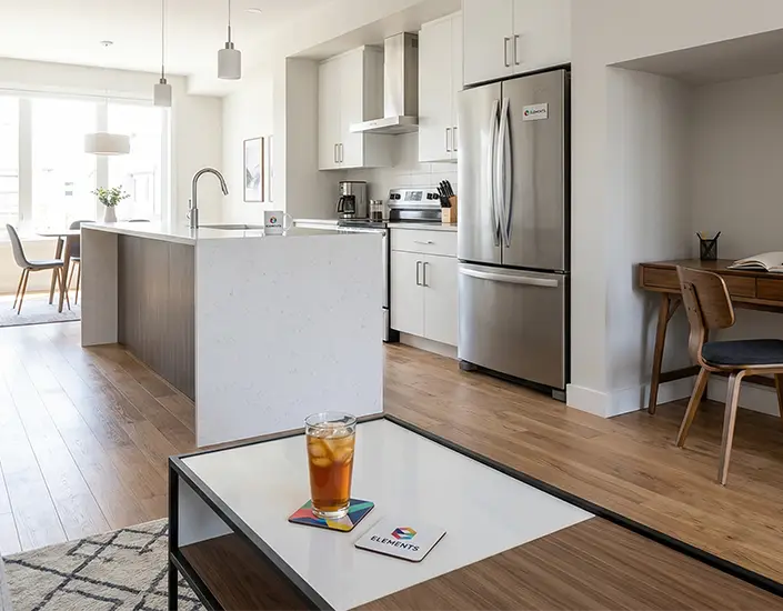 Modern home interior with drink on custom branded coaster placed on coffee table in open-concept living space