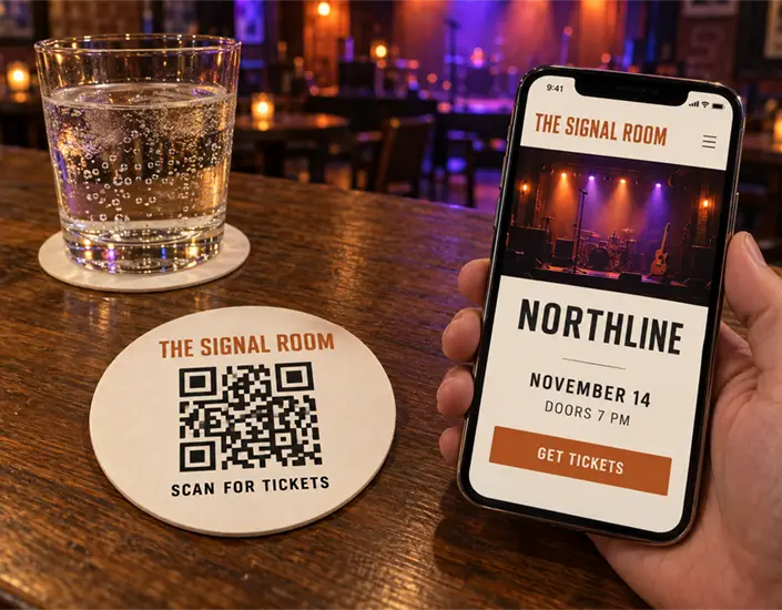 Phone displaying Northline's concert ticket page beside a Signal Room QR coaster reading 